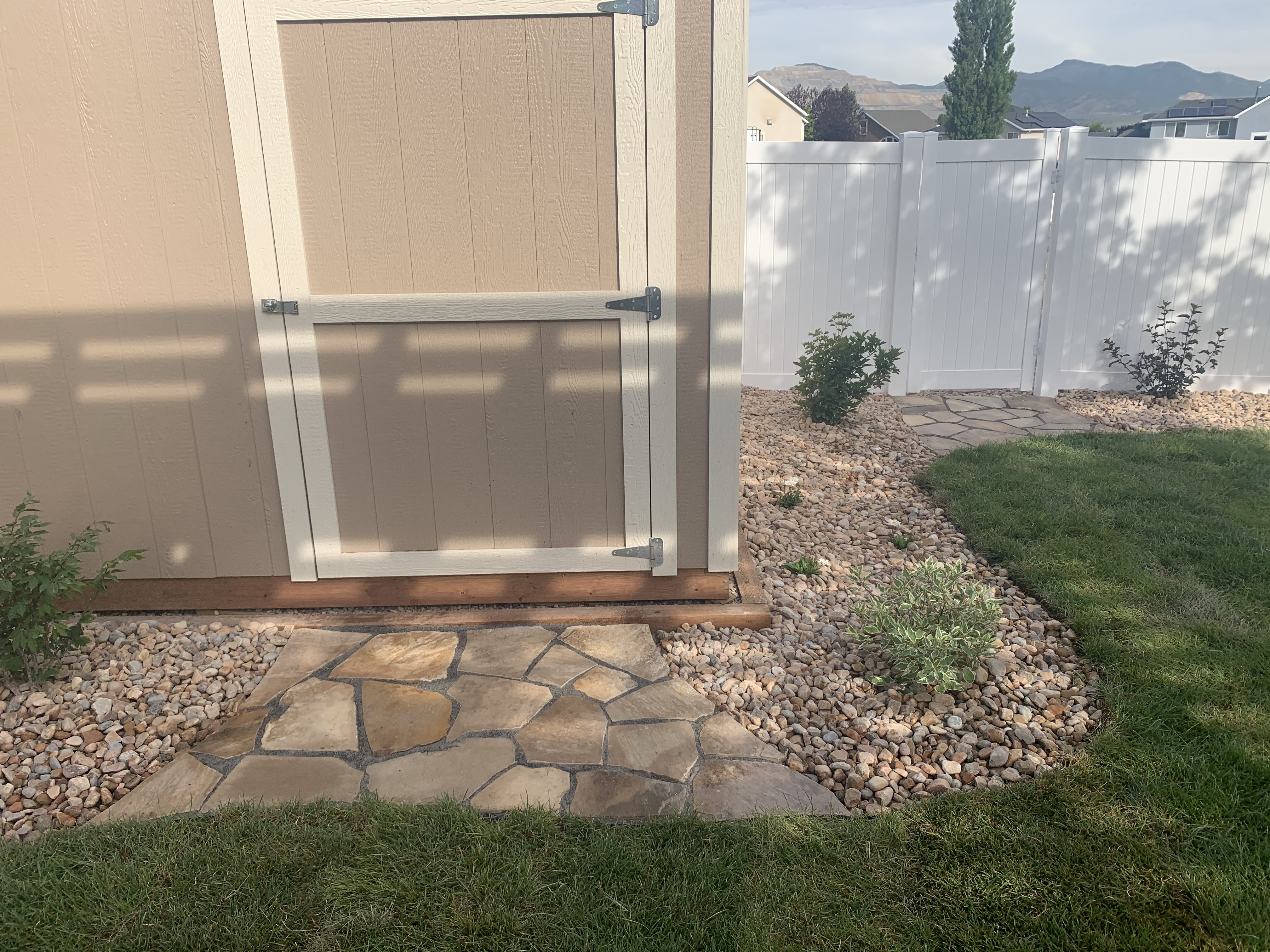 IMG-3553 Hardscaped rocked laid as paving for side of home