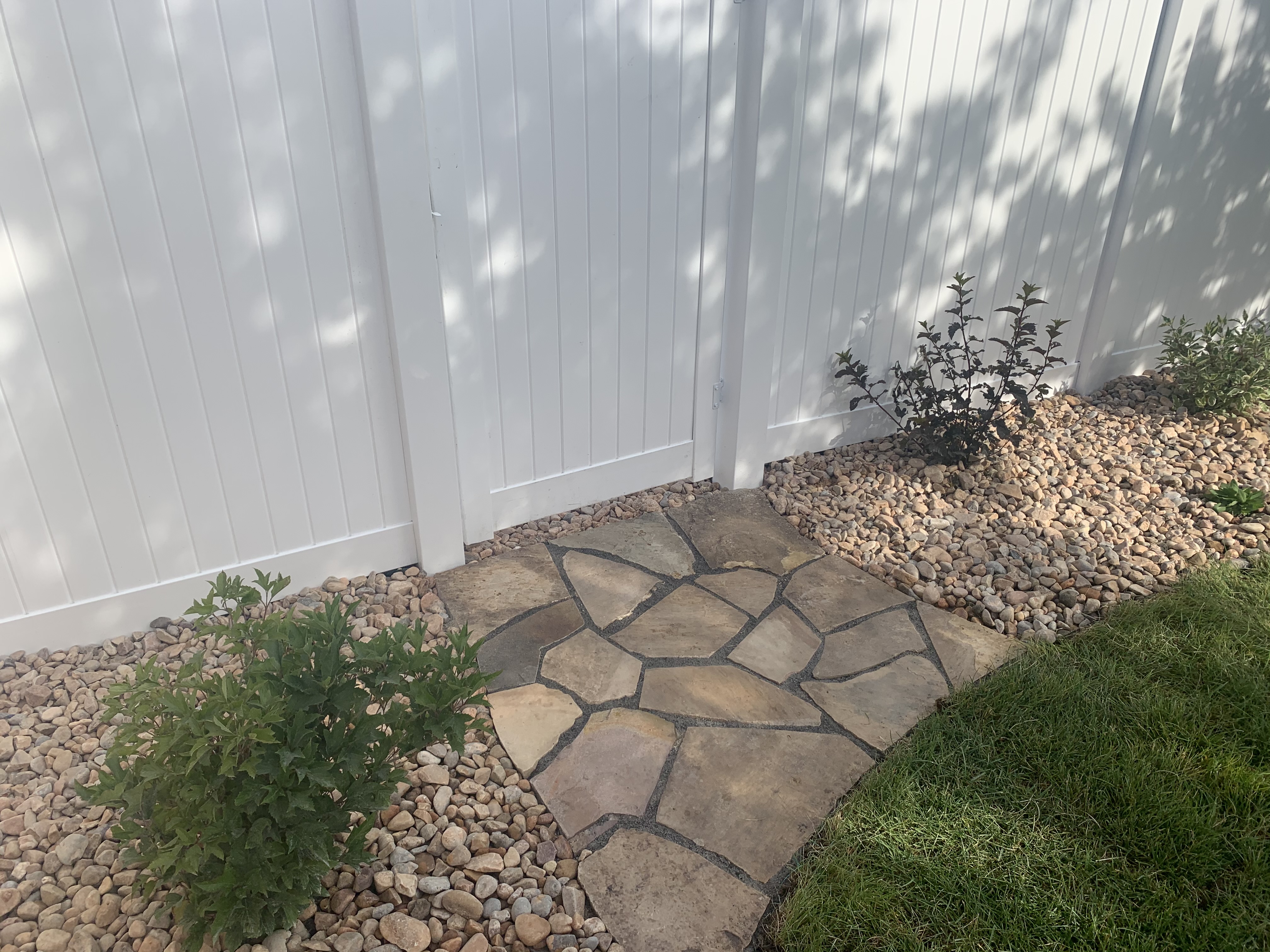 IMG-3555 Hardscaped rocked laid as paving for fence line
