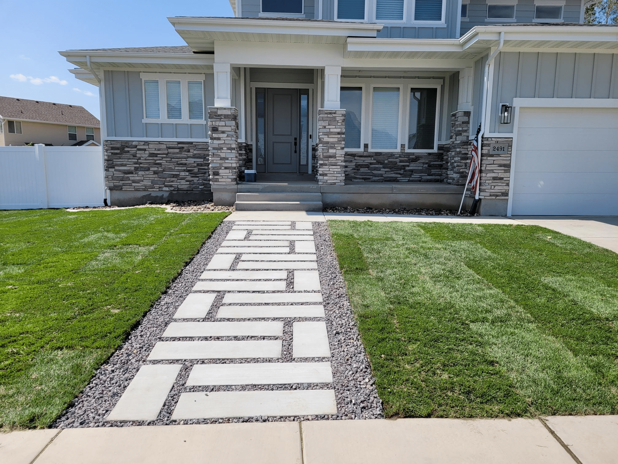 image Concrete walkway leading to residential home.