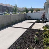 CONCRETE PATIO FORMAL 2019 Concrete slabs being used as a patio near fence