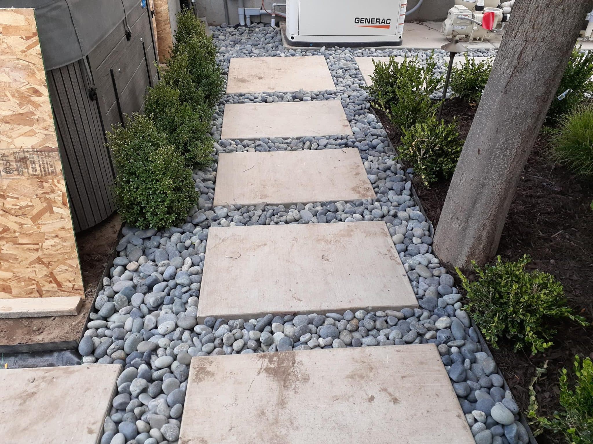 CONCRETE PAVERS ELLIOT SMITH 11-12-2020 Concrete walkway with small rocks inbetween