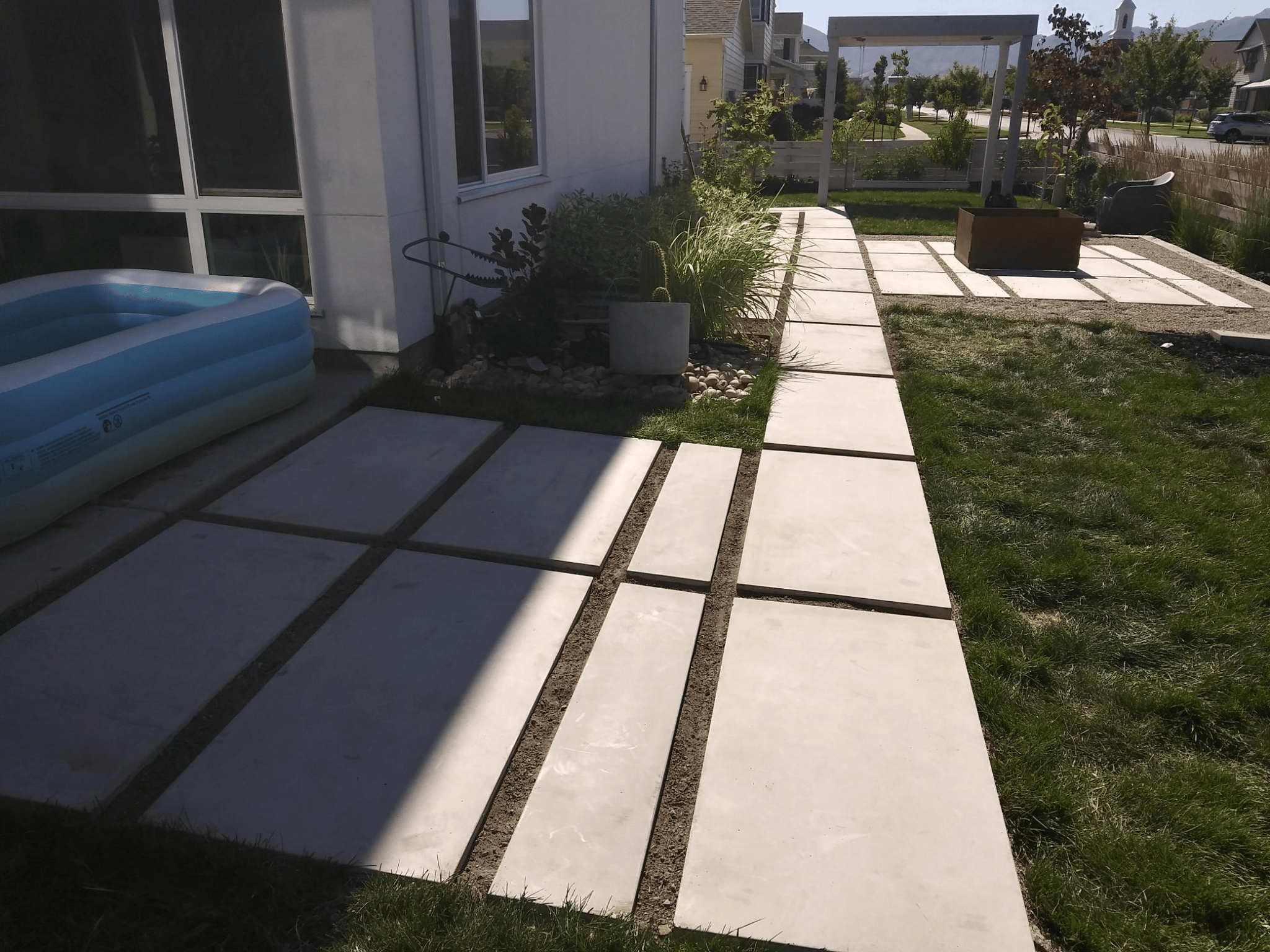 HUSKIE’Z CONCRETE (FORMAL) 9-15-2020 Concrete slabs leading to small swimming pool in backyard