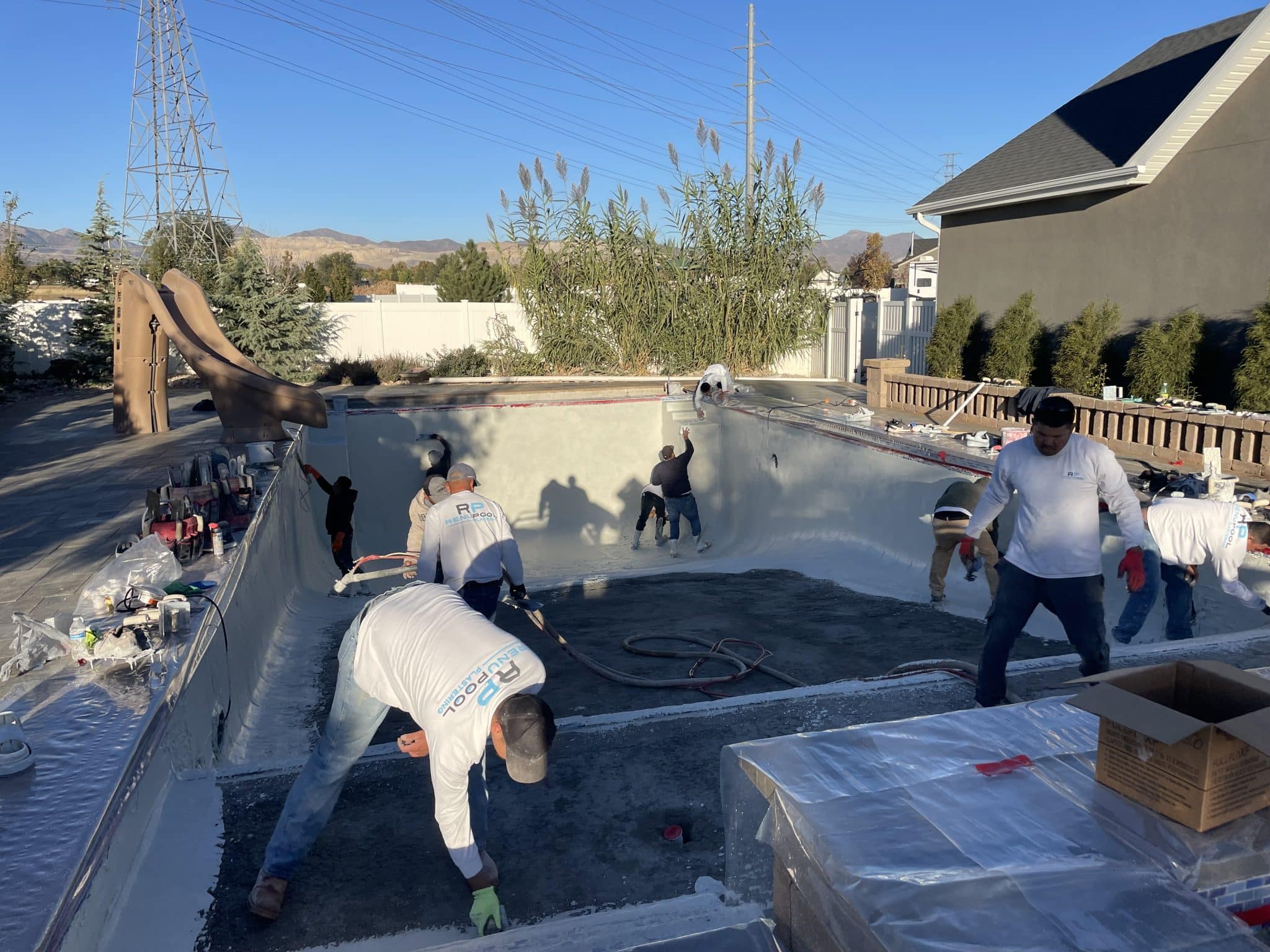 IMG-1074 Men finishing up a swimming pool build