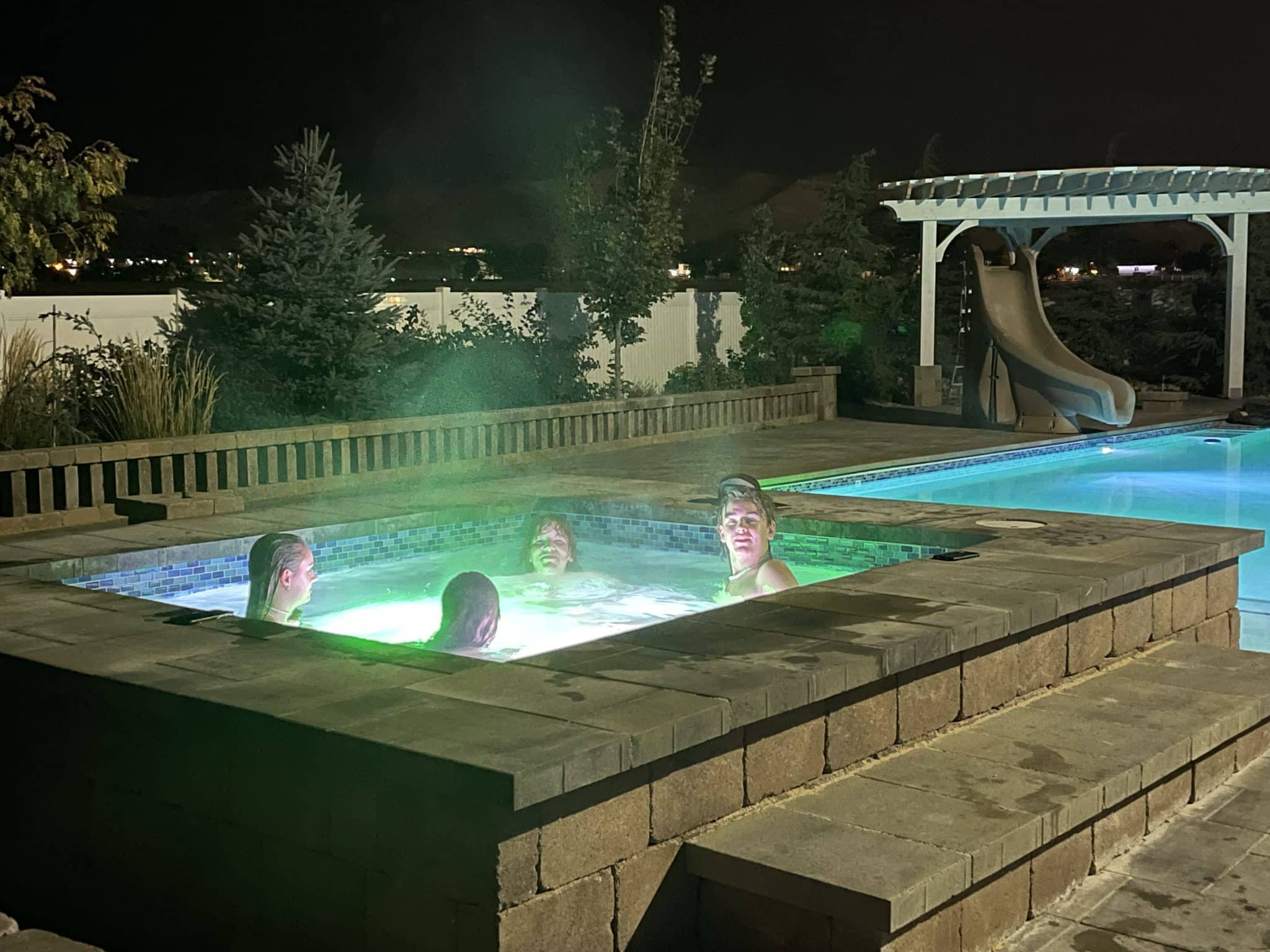 IMG-1180 A family sitting in their newly built swimming pool