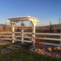 WHITE ARBOR HINCKLEY HOME 2018 Pergola gate leading to a home