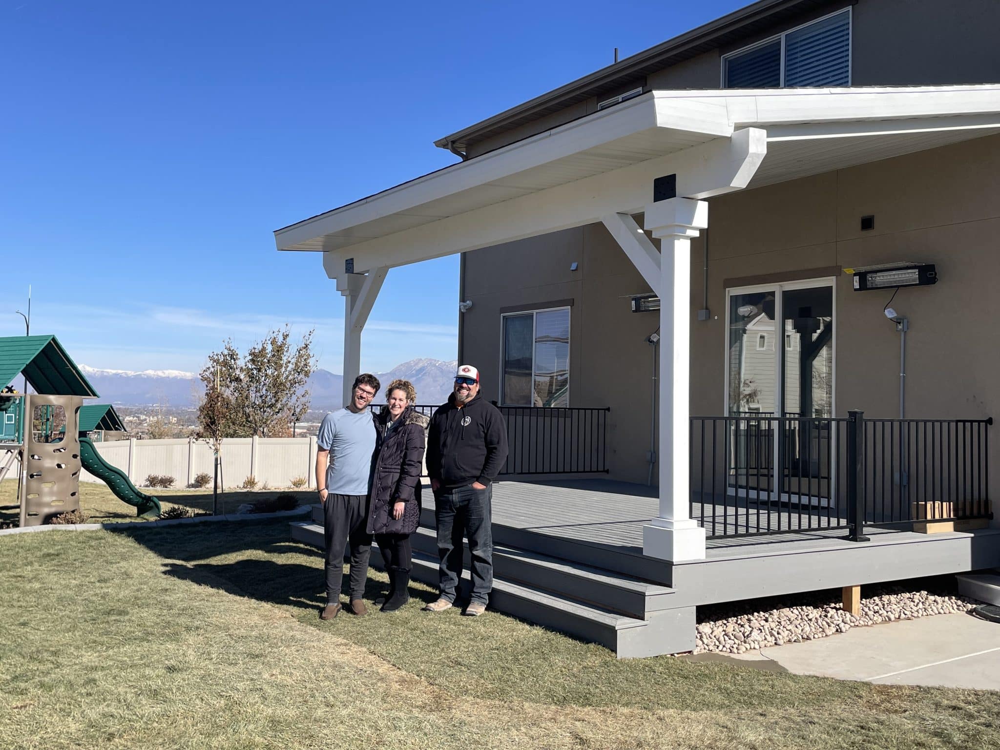 image_50457857 Custom deck built on to a residential home with family and owner of Huskie's Landscaping