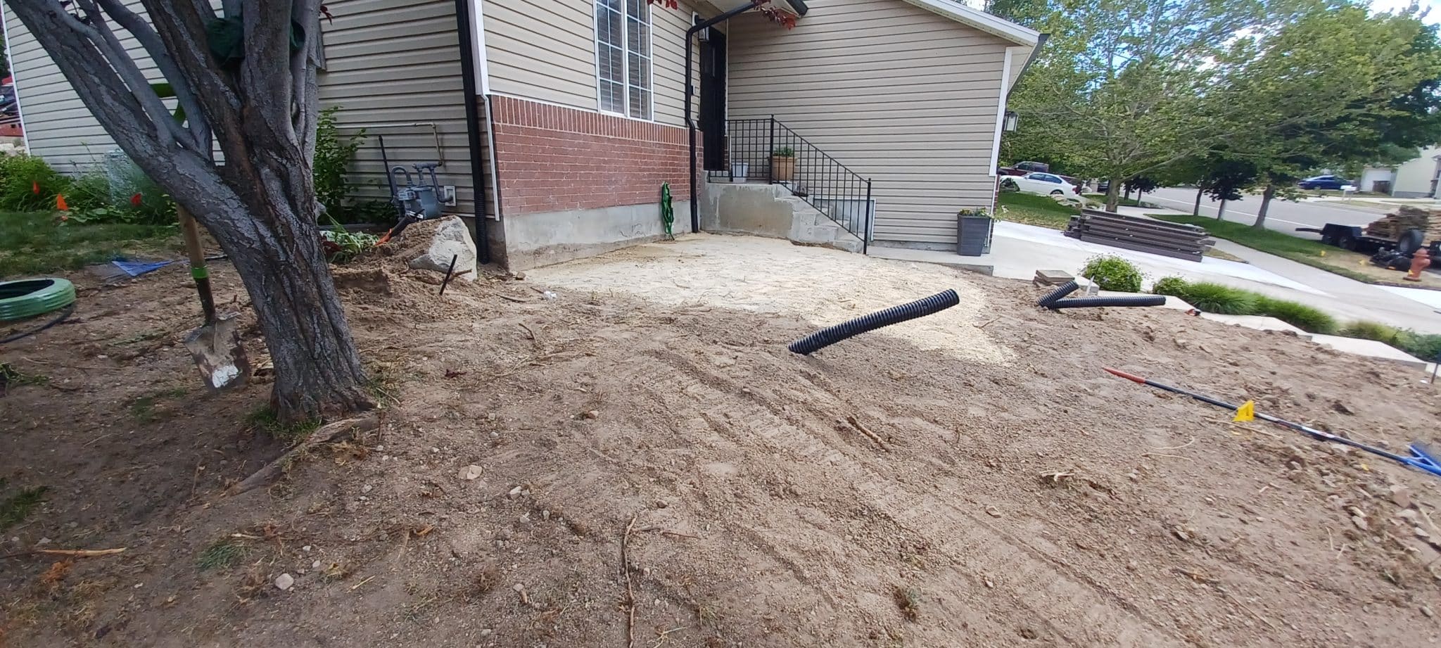 FLAGSTONE PATIO (BEFORE) Dirt lot almost ready for walkway instal
