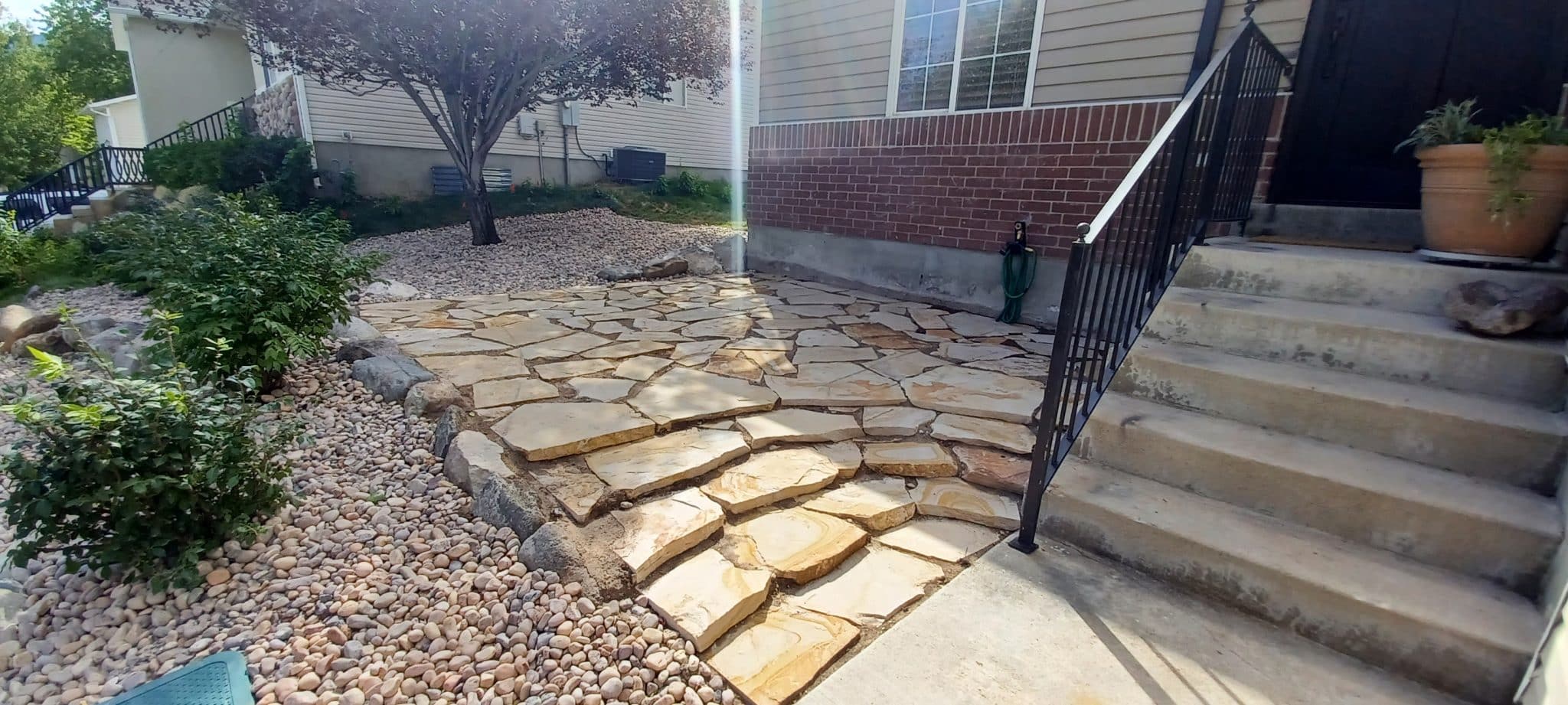 FLAGSTONE PATIO Stone steps installed in front of home