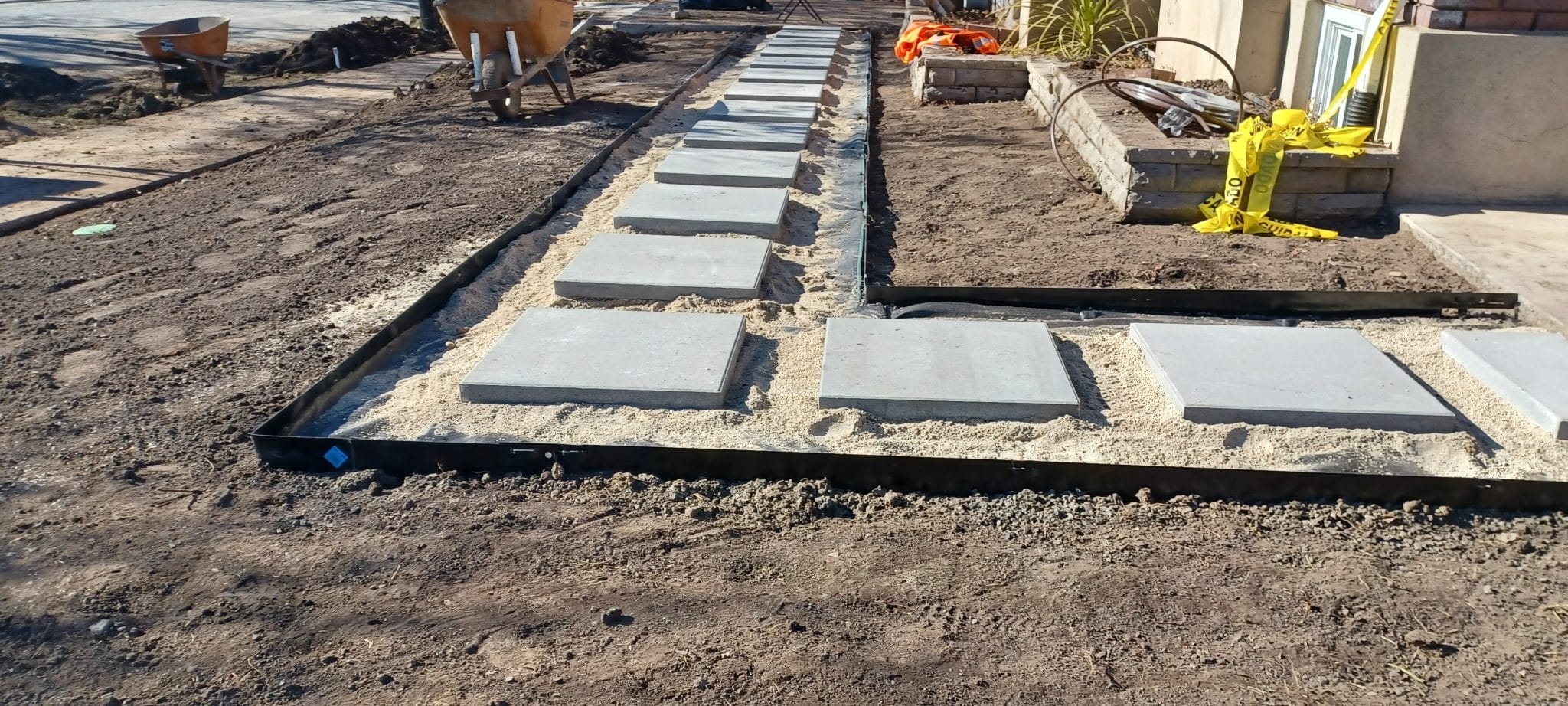 PAVER PATH (BEFORE1) Paved path on the side of a home
