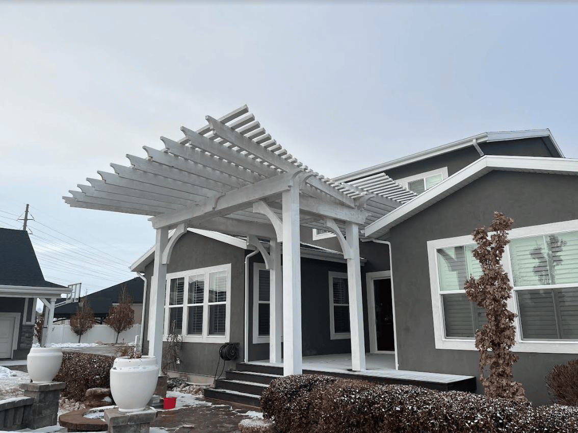 Screen Shot 2023-01-25 at 3.17.17 PM Side view of pergola built in a home's backyard