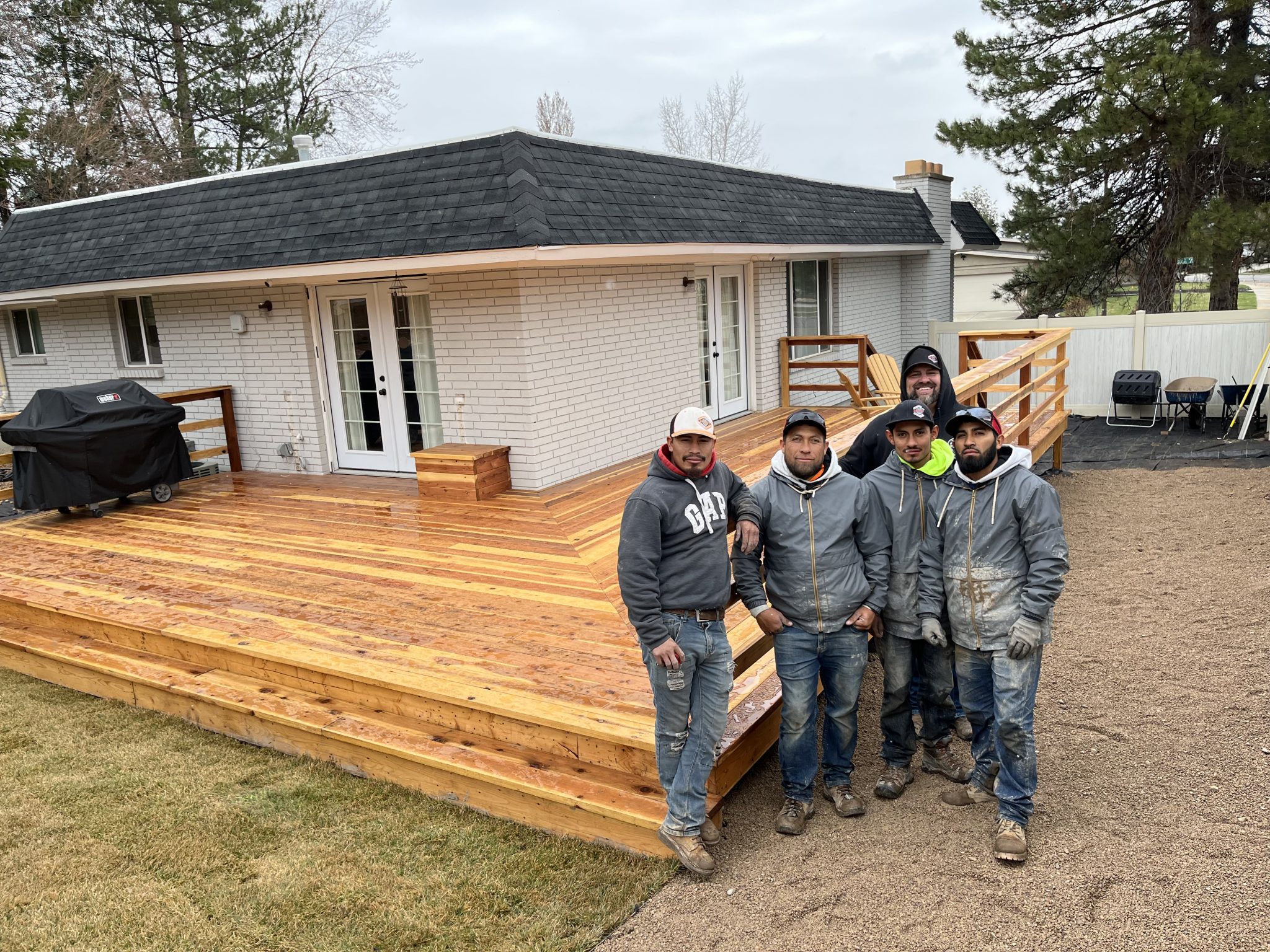 IMG-3116 Huskie'z team after they built a new custom wood deck