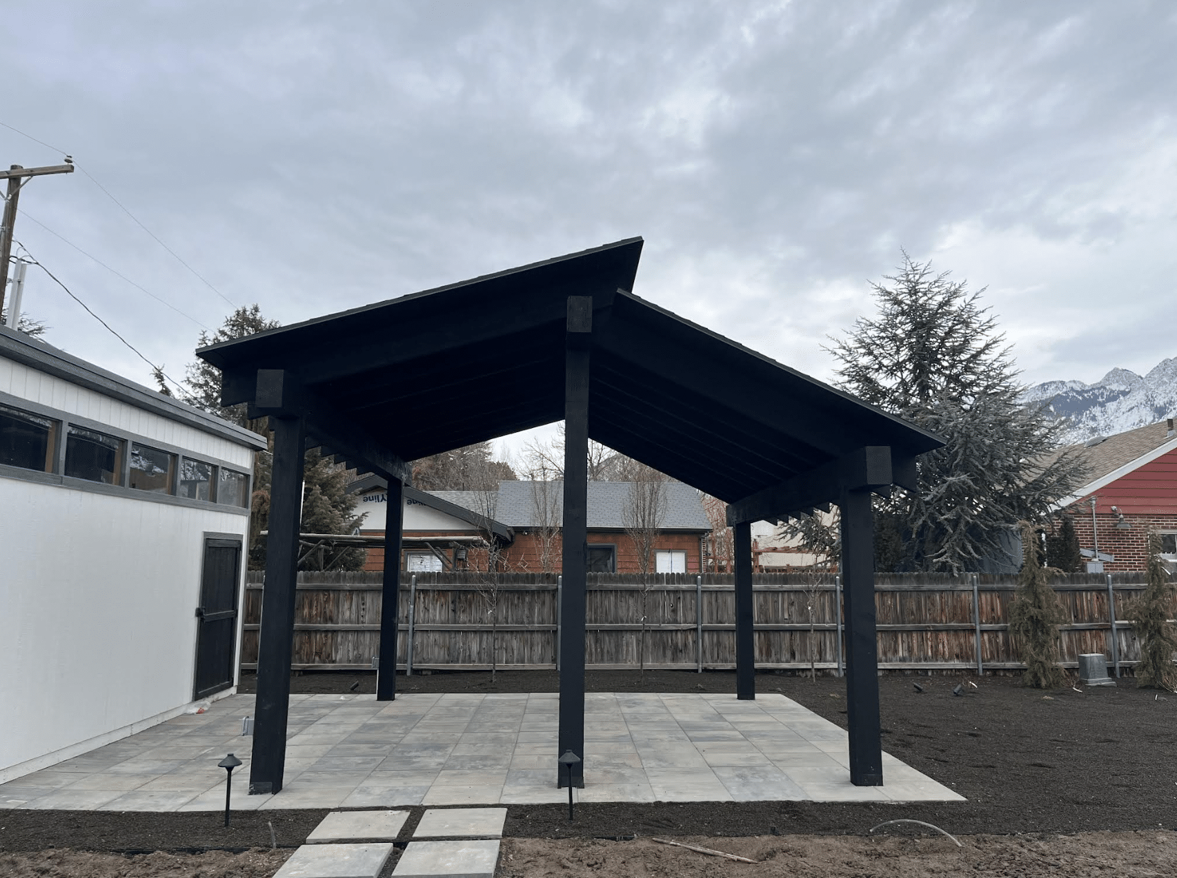 Screen Shot 2024-02-19 at 11.40.27 AM View of a pergola from the side on a concrete patio