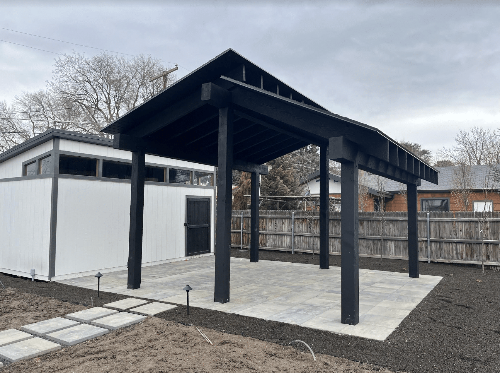 Screen Shot 2024-02-19 at 11.40.57 AM Small dark pergola new build for a residential home.
