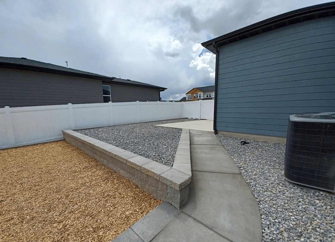Screen Shot 2024-09-18 at 12.32.48 PM Low retaining wall on the side of a home