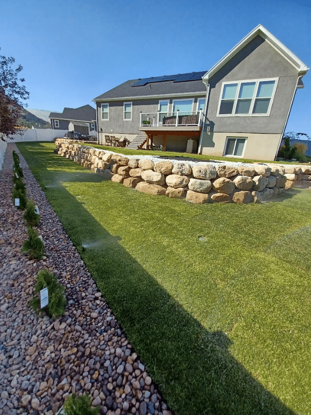 Screen Shot 2024-09-18 at 12.34.42 PM Brick wall installed on a homes yard