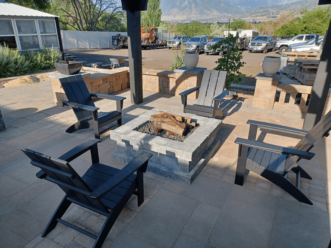Screen Shot 2024-09-18 at 12.35.57 PM Back yard outdoor fireplace for a home with chairs around