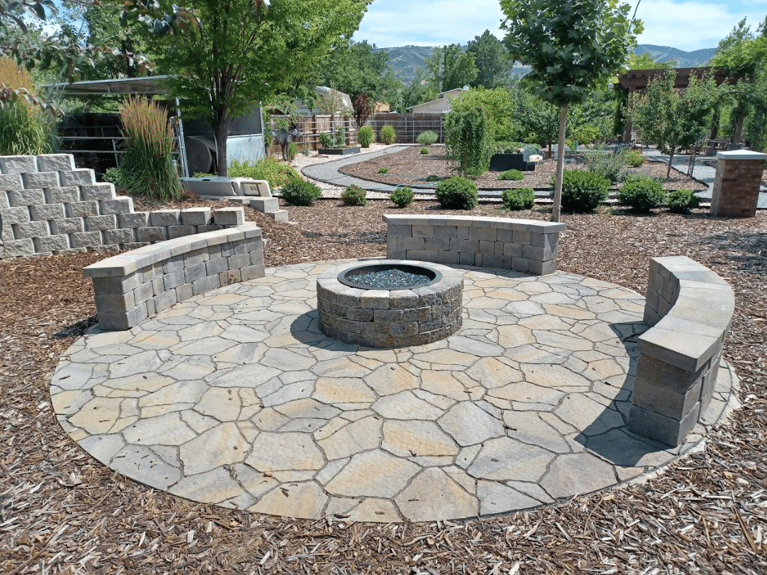 Screen Shot 2024-09-18 at 12.36.04 PM Round paved area in home's backyard with fire pit