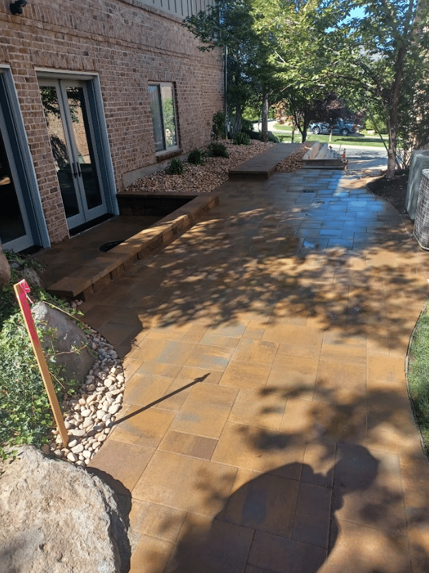 Screen Shot 2024-09-18 at 12.39.04 PM Beautiful brown paving on the side of a home