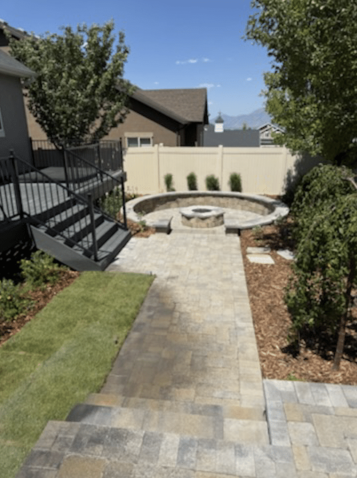 Huskie’z 2 Deck and walkway leading to an outdoor fireplace