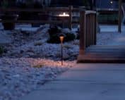 Xeriscape with dry river bed, landscape lighting and fire pit