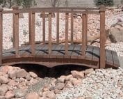 Xeriscape with foot bridge, dry river bed and native plants